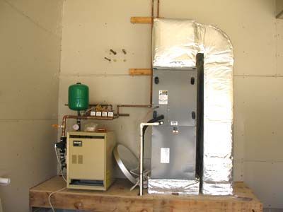 An air conditioner is sitting on a wooden table in a room.