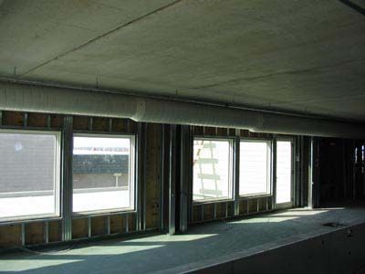 A building under construction with a lot of windows and a ceiling.