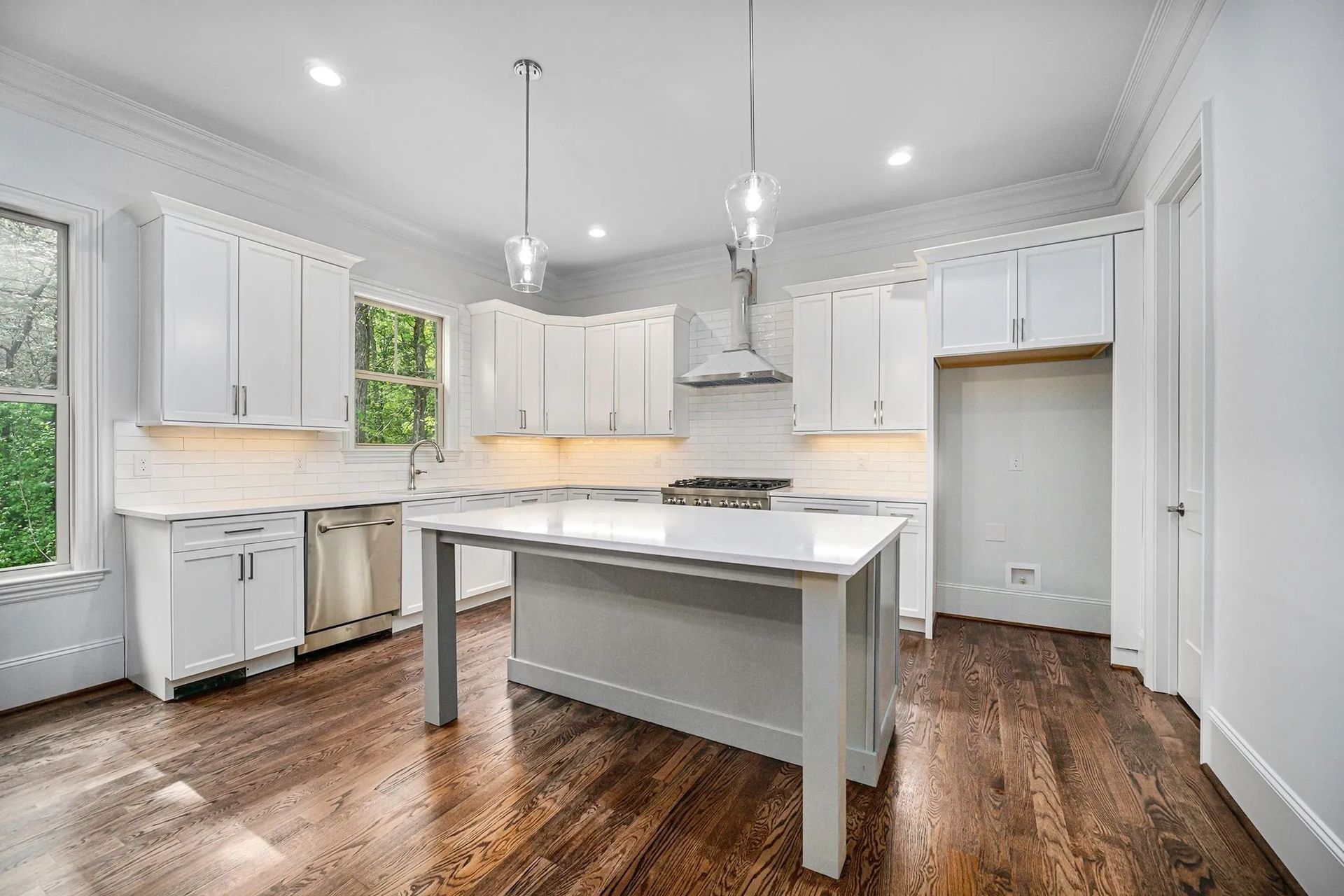There is a large island in the middle of the kitchen.