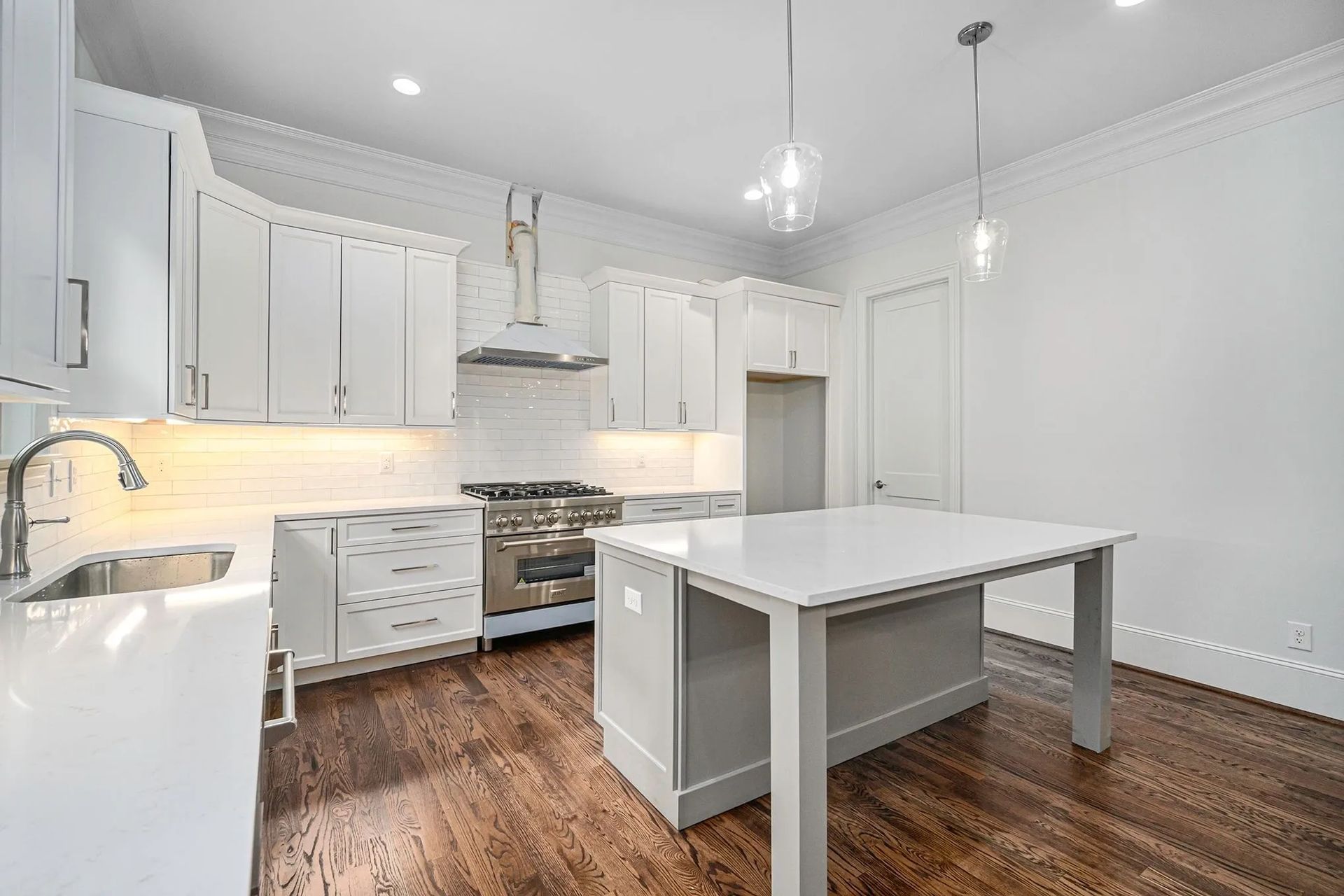 There is a large island in the middle of the kitchen.