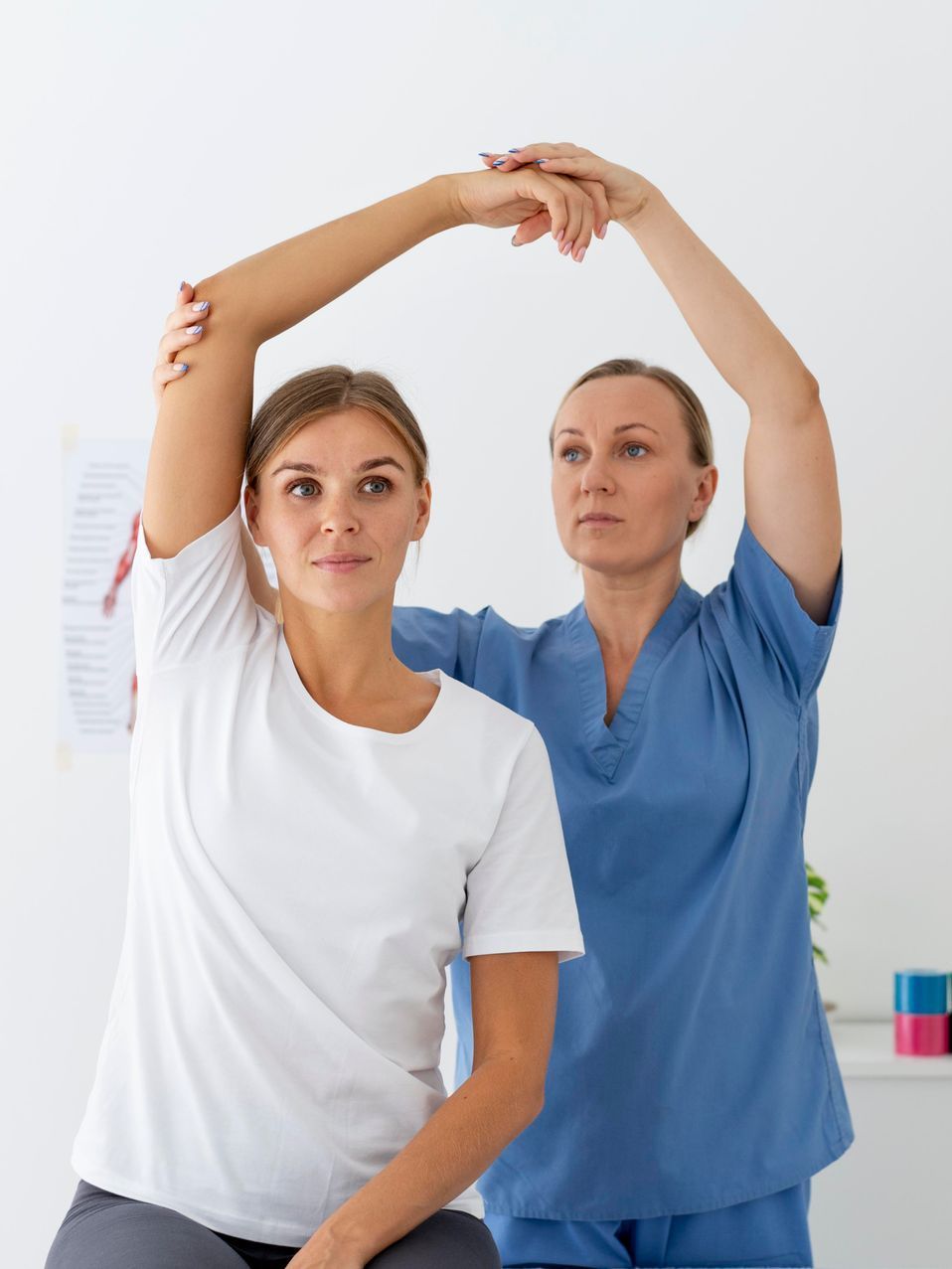 physiotherapist assisting female patient