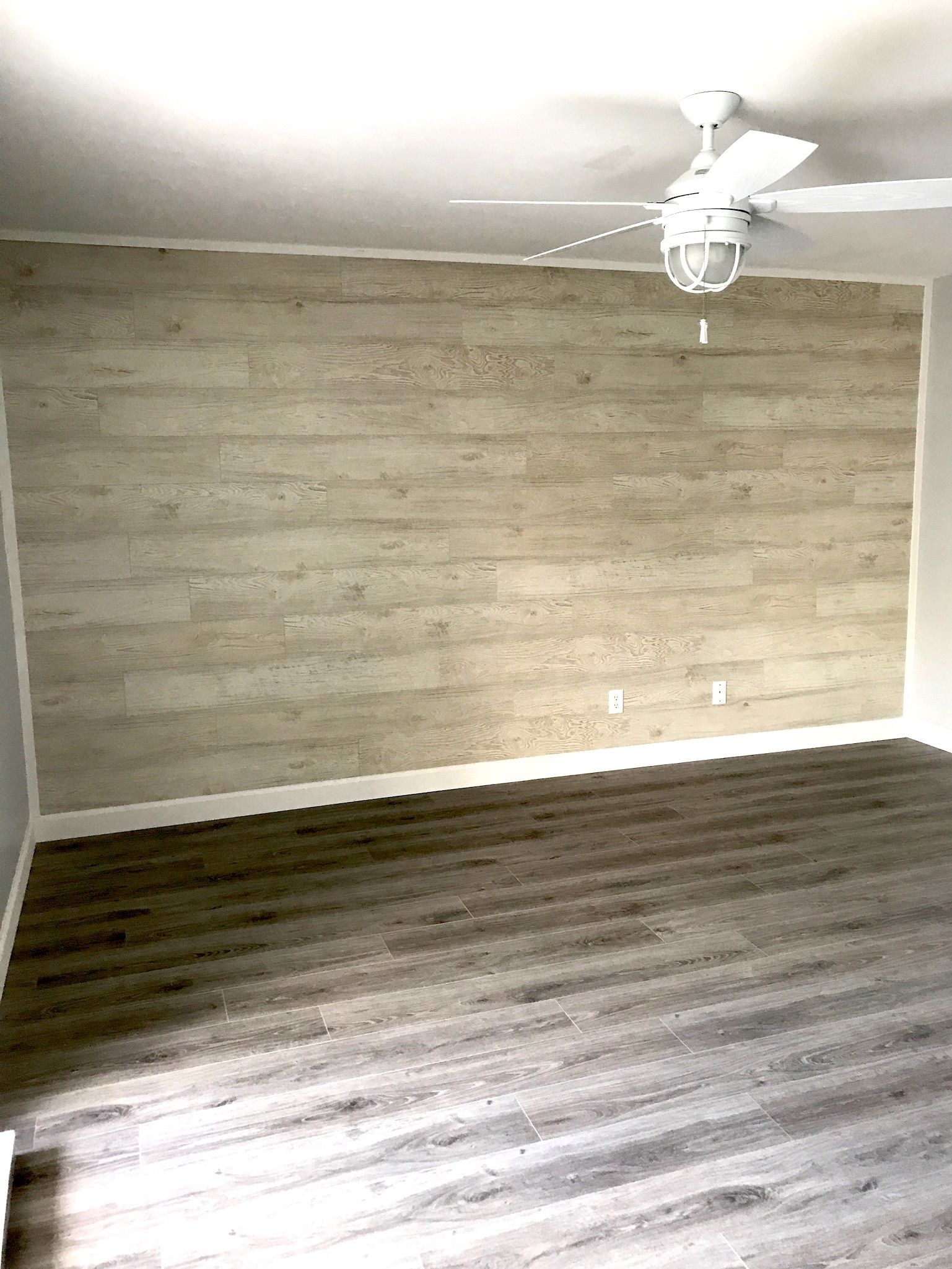 There is a ceiling fan in the room.