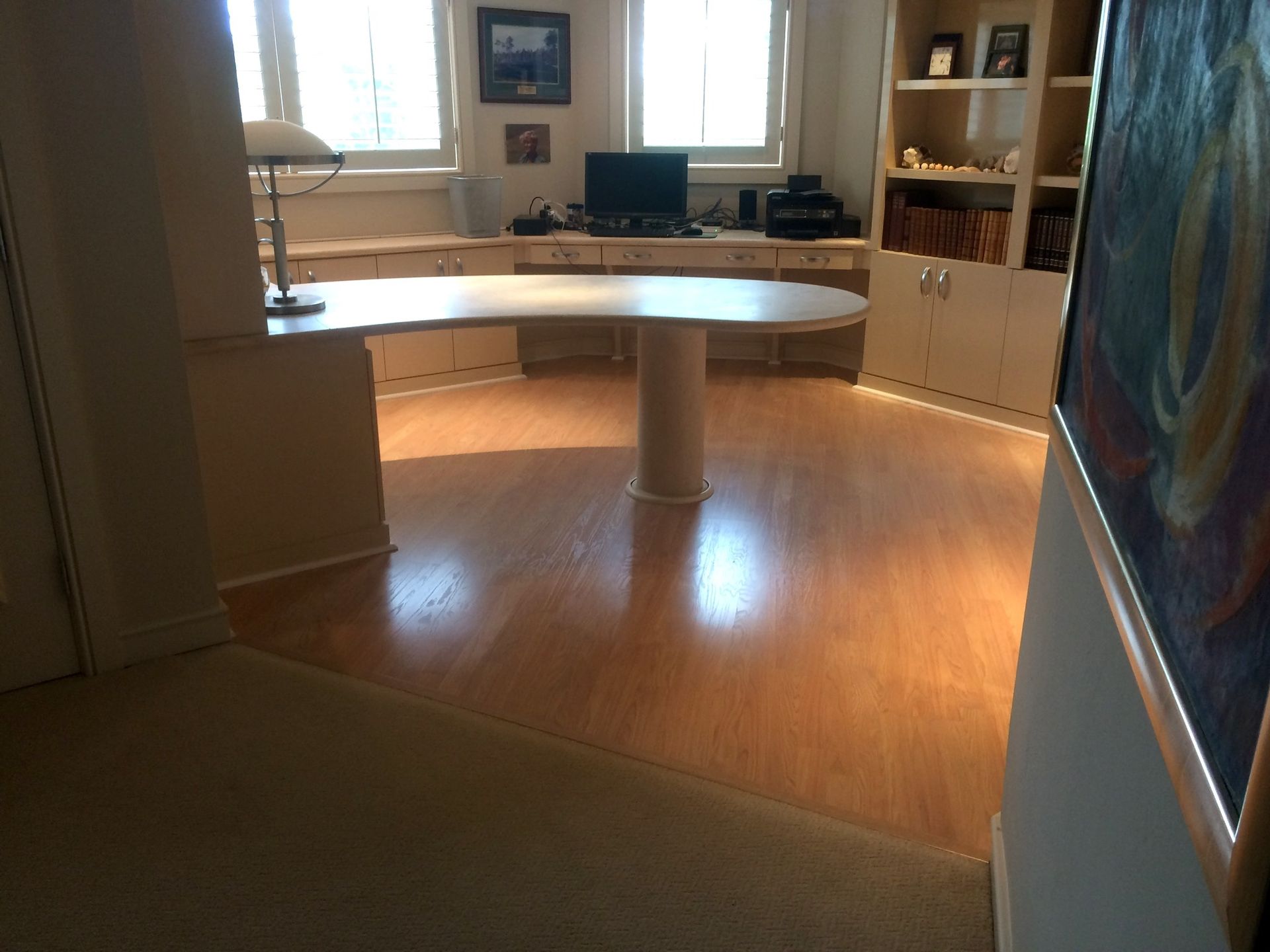 A room with a desk and a computer on it