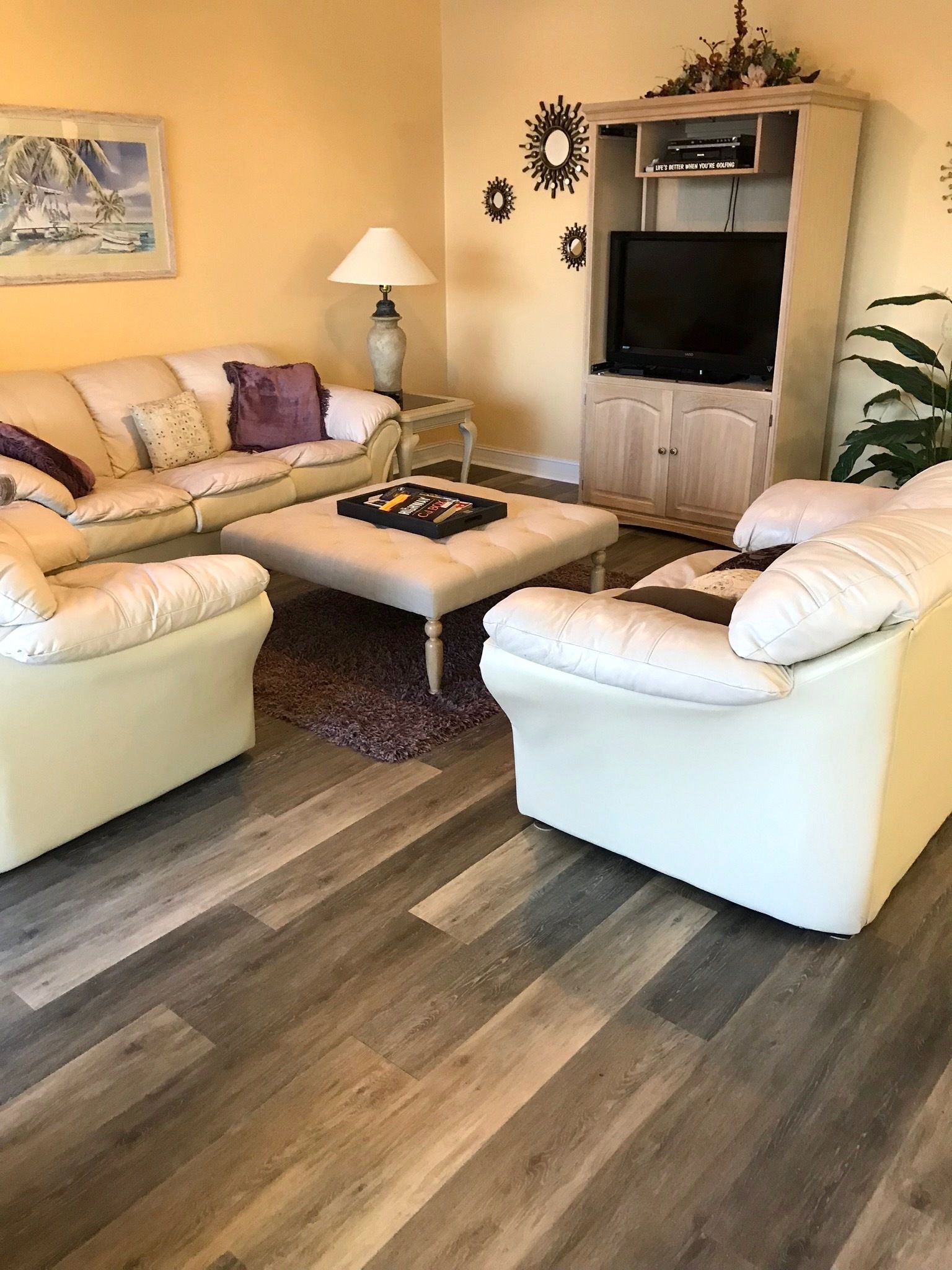 A living room filled with furniture and a flat screen tv.