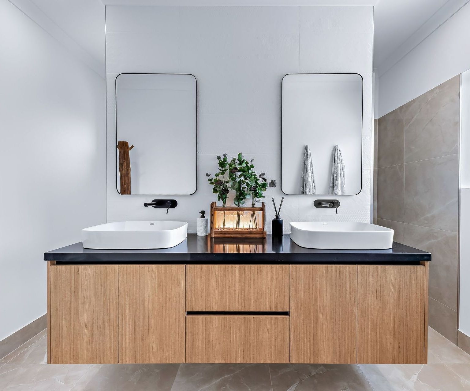 A Bathroom With Two Sinks And A Wooden Vanity — North Coast Cabinetmaking Pty Ltd In Proserpine, QLD