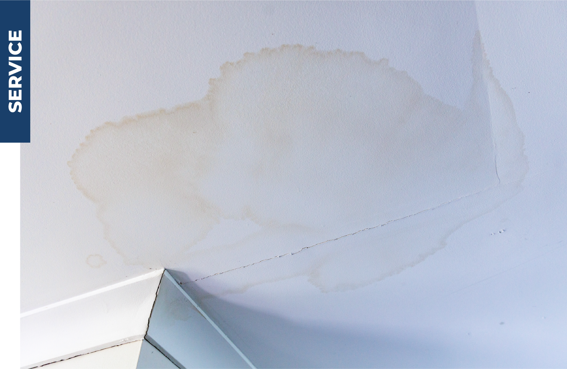 A ceiling with a stain on it and the word service on the bottom