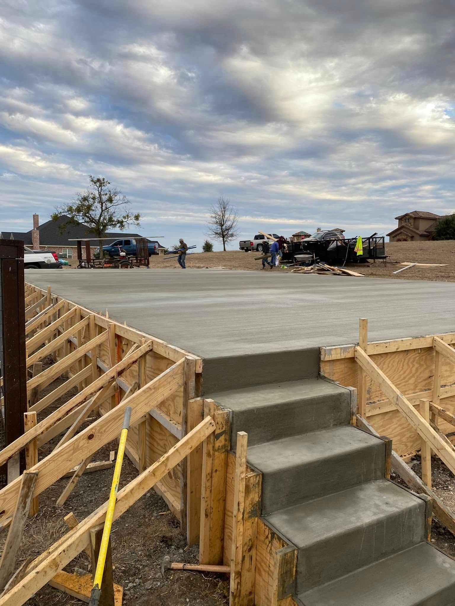 A concrete staircase is being built on a construction site.