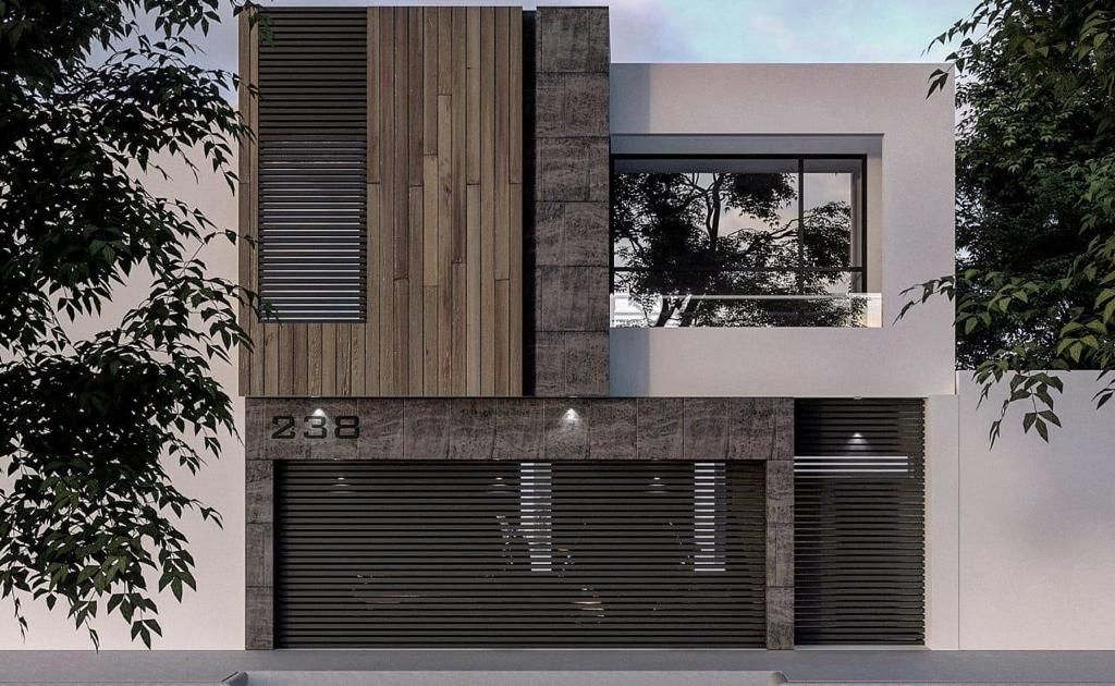 Casa moderna de dos plantas con fachada de madera y piedra. Puerta de garaje oscura y gran ventanal.
