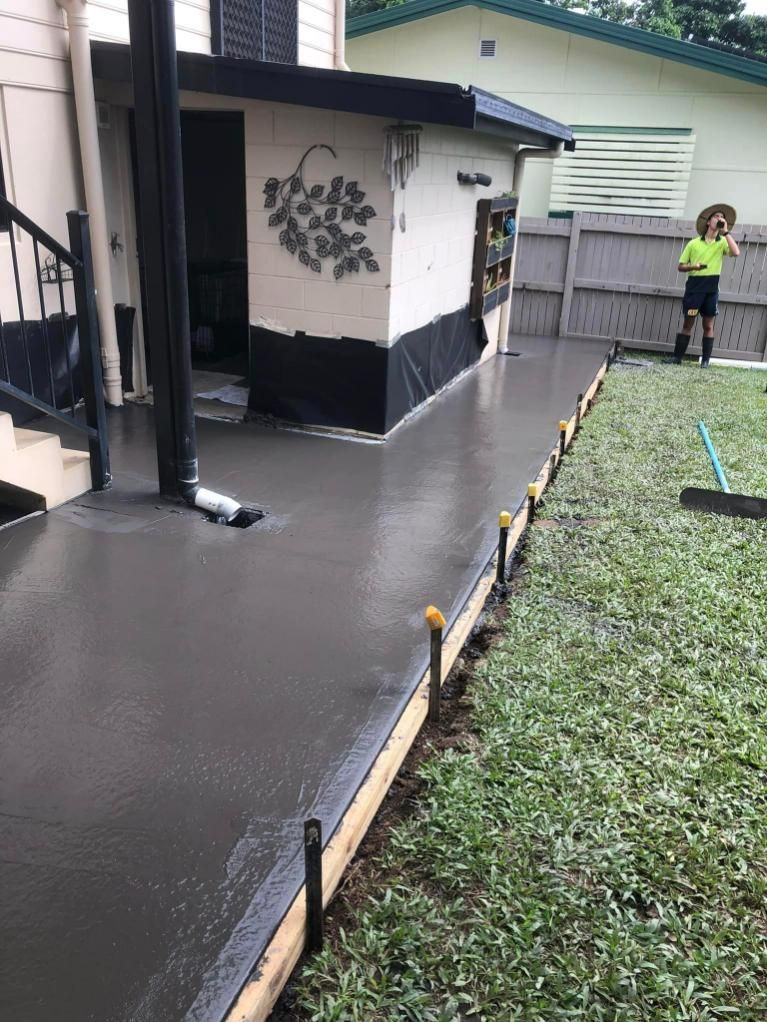 A Wet Concrete Walkway In Front Of A House — Value Concreting In Gordonvale, QLD