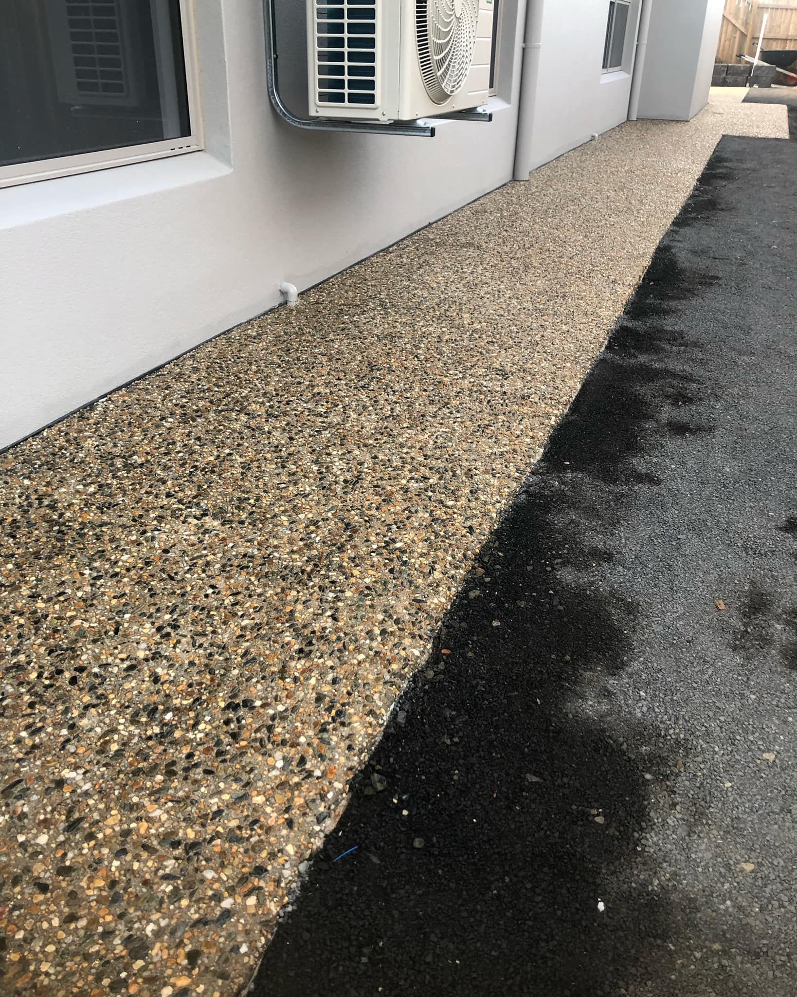 Gravel Path Next to a White Wall — Value Concreting In Cairns, QLD