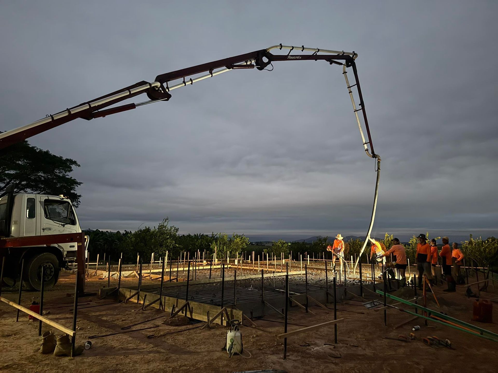 Concrete Being Poured at a Construction Site by a Pump Truck — Value Concreting In Cairns, QLD