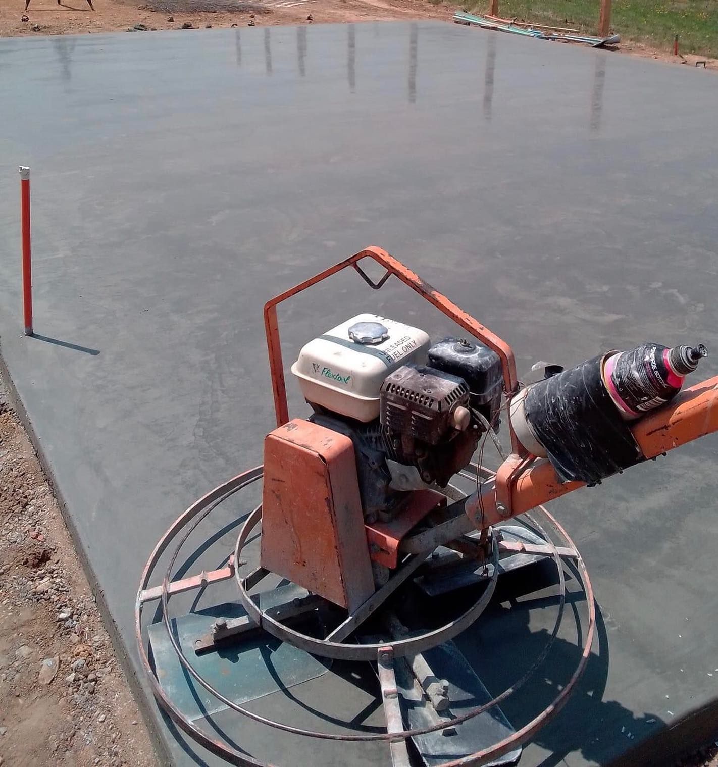 Concrete Being Smoothed by a Power Trowel — Value Concreting In Mission Beach, QLD