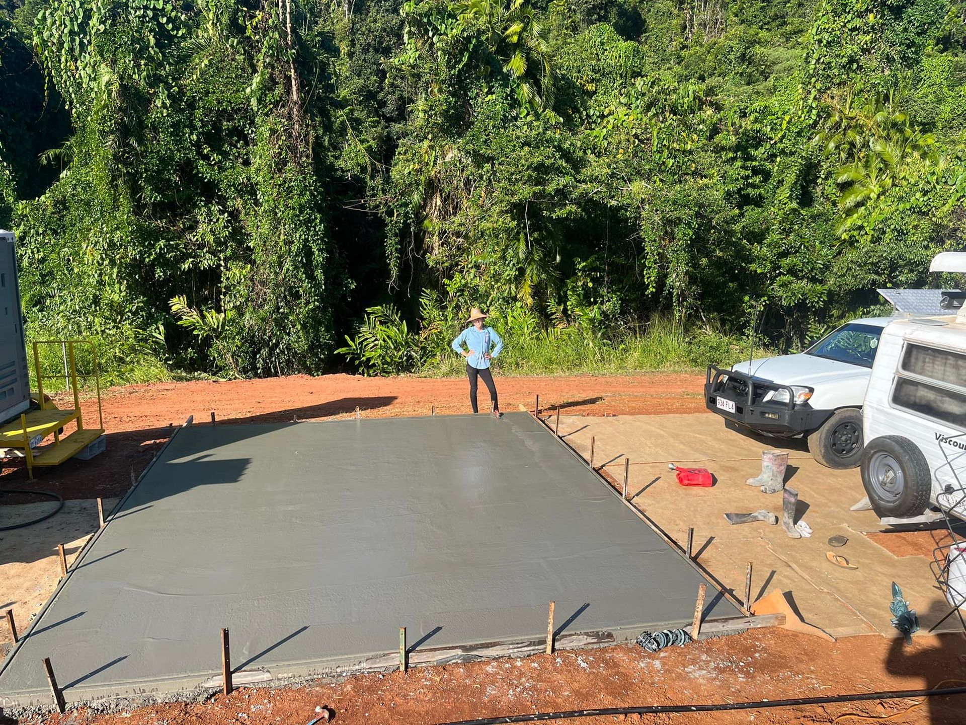 Person Standing on a Freshly Poured Concrete Slab — Value Concreting In Mission Beach, QLD