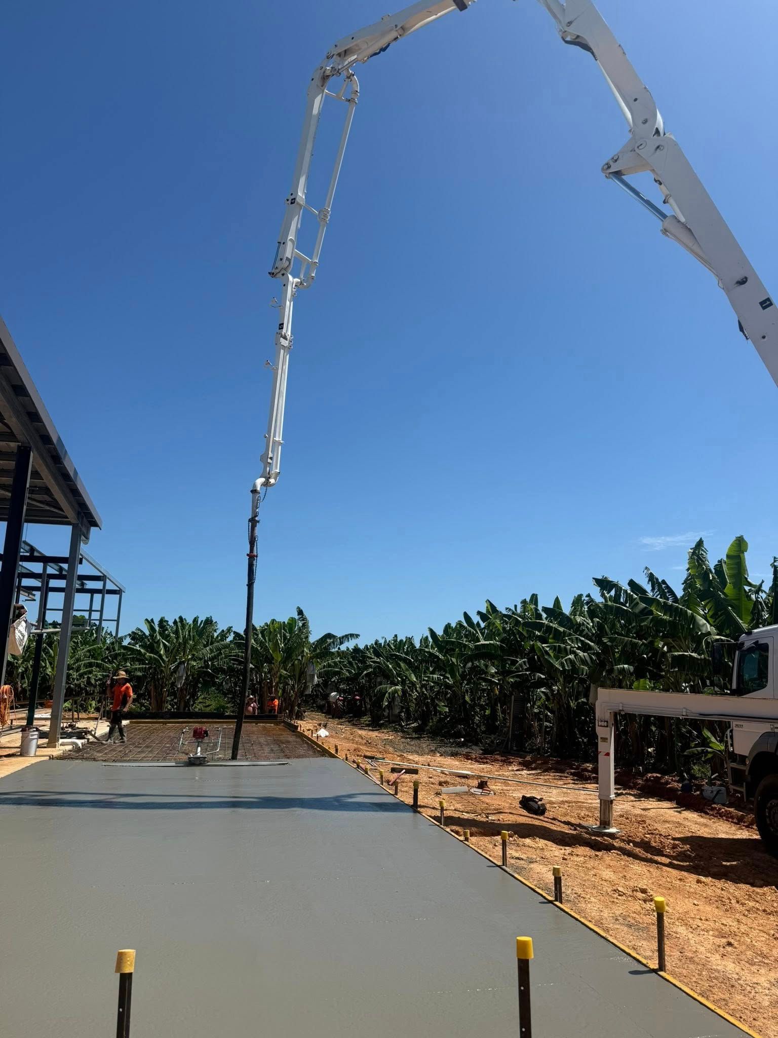 Concrete Being Poured by a Boom Pump — Value Concreting In Innisfail, QLD