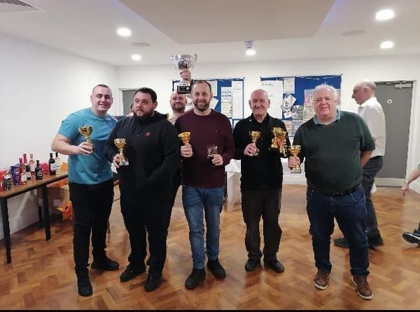 Members of the double-winning Horns Tavern team celebrating their success – left to right; Ryan Ward, Jamie Skipsey, Chris Owens (Team Captain – behind, holding the Knock Out Cup aloft), Lee Suggars, Danny Bourke and Eamonn Staunton.