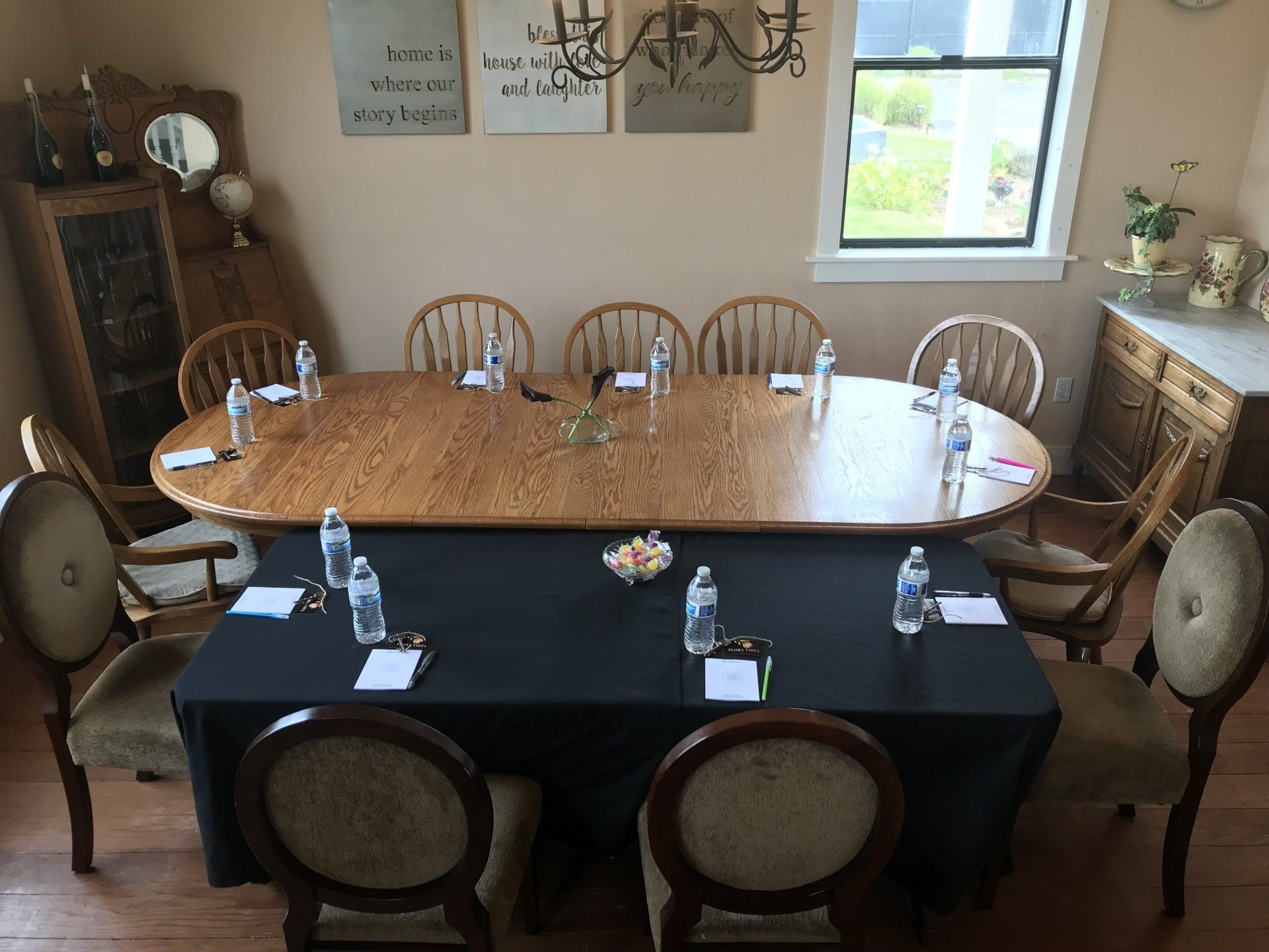 A room with a table and chairs set up for a meeting