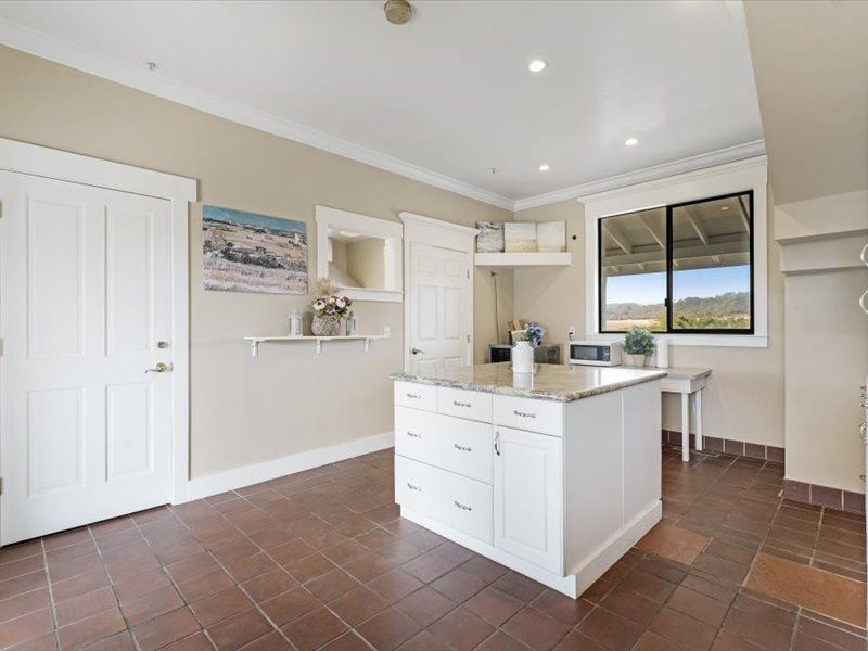 A kitchen with a large island in the middle of the room.