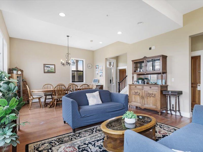 A living room with a blue couch and a coffee table.