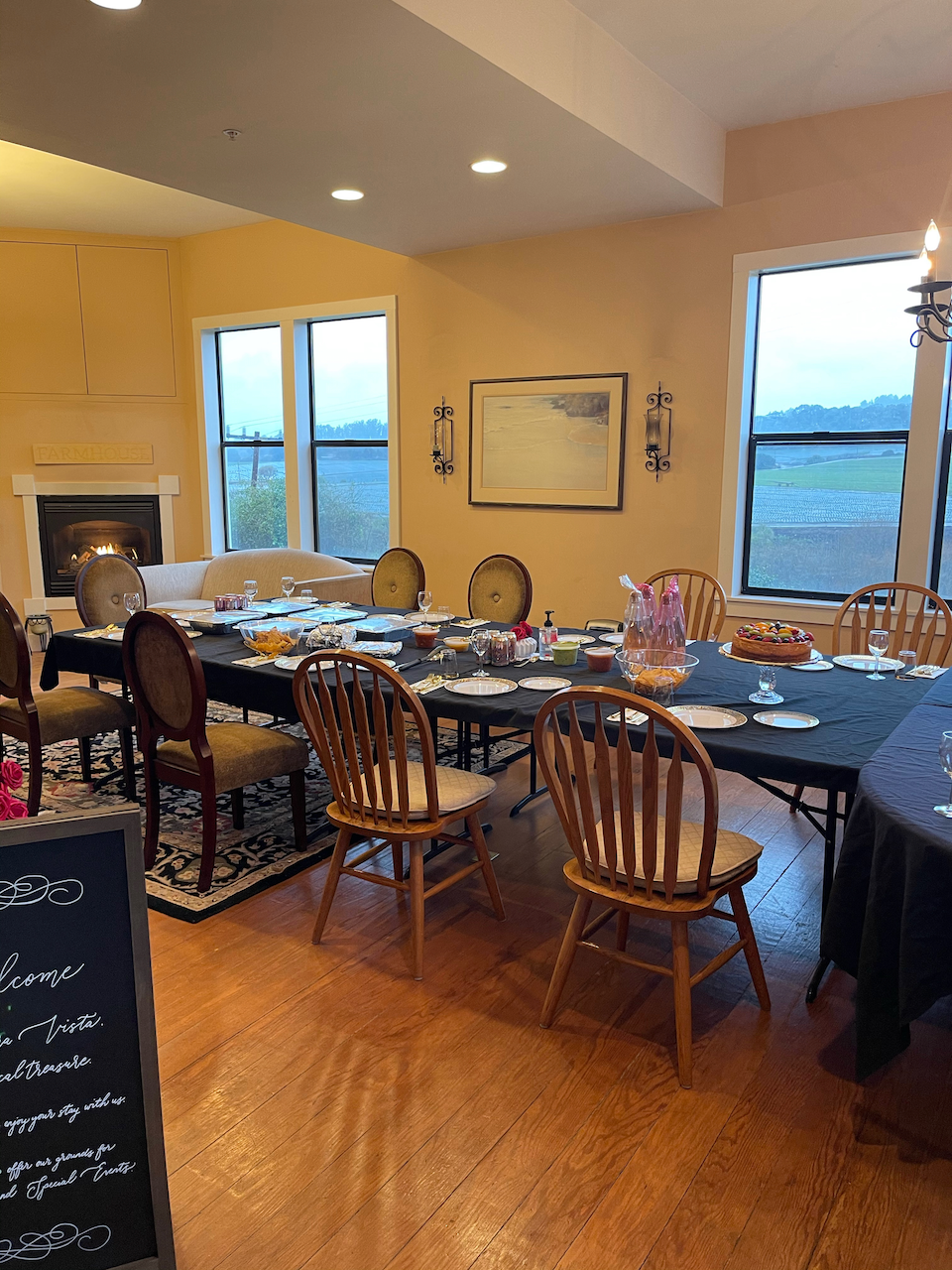 A large room with tables and chairs set up for a party.