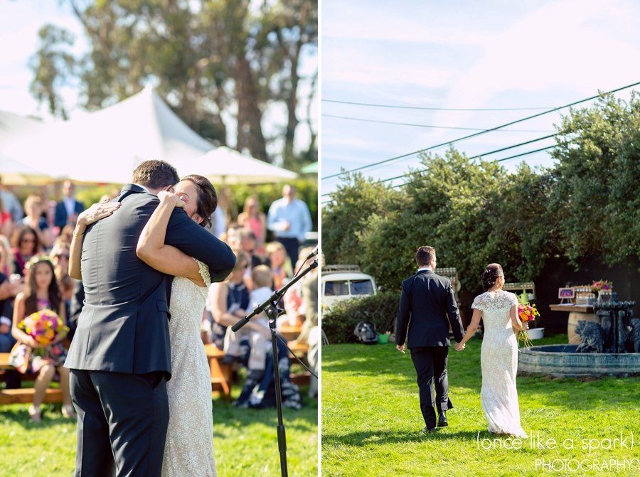 A bride and groom are walking down the aisle at their wedding.