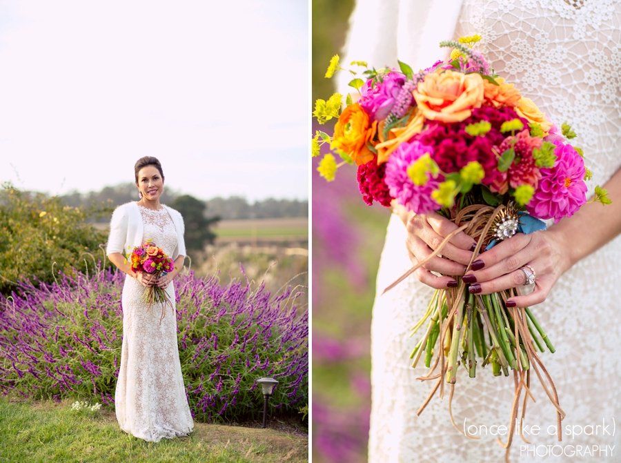A bride in a white dress is holding a bouquet of flowers.
