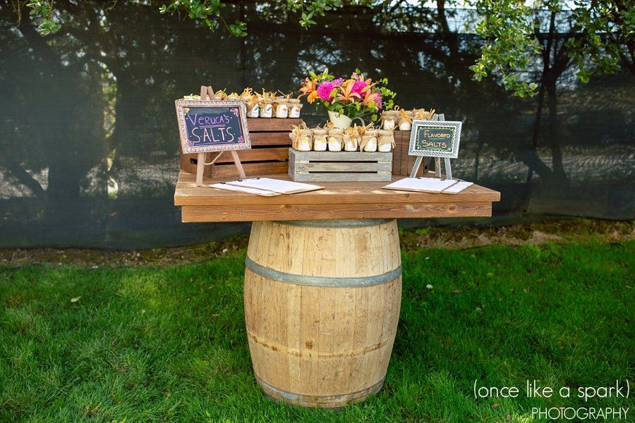 A wooden table is sitting on top of a wooden barrel.