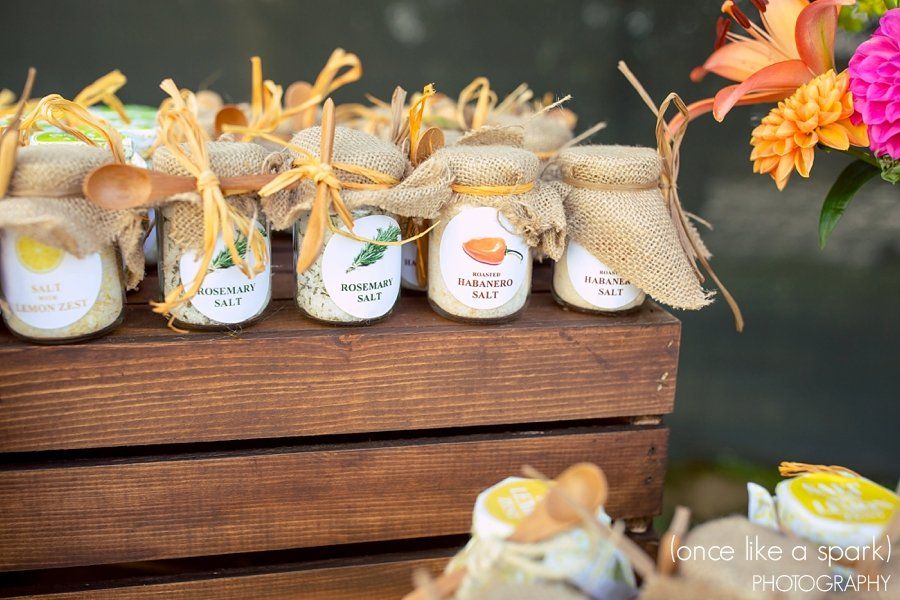 A row of jars sitting on top of a wooden crate.
