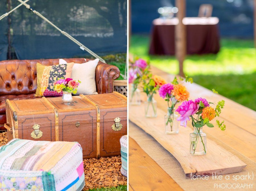 A couch and a table with vases of flowers on it