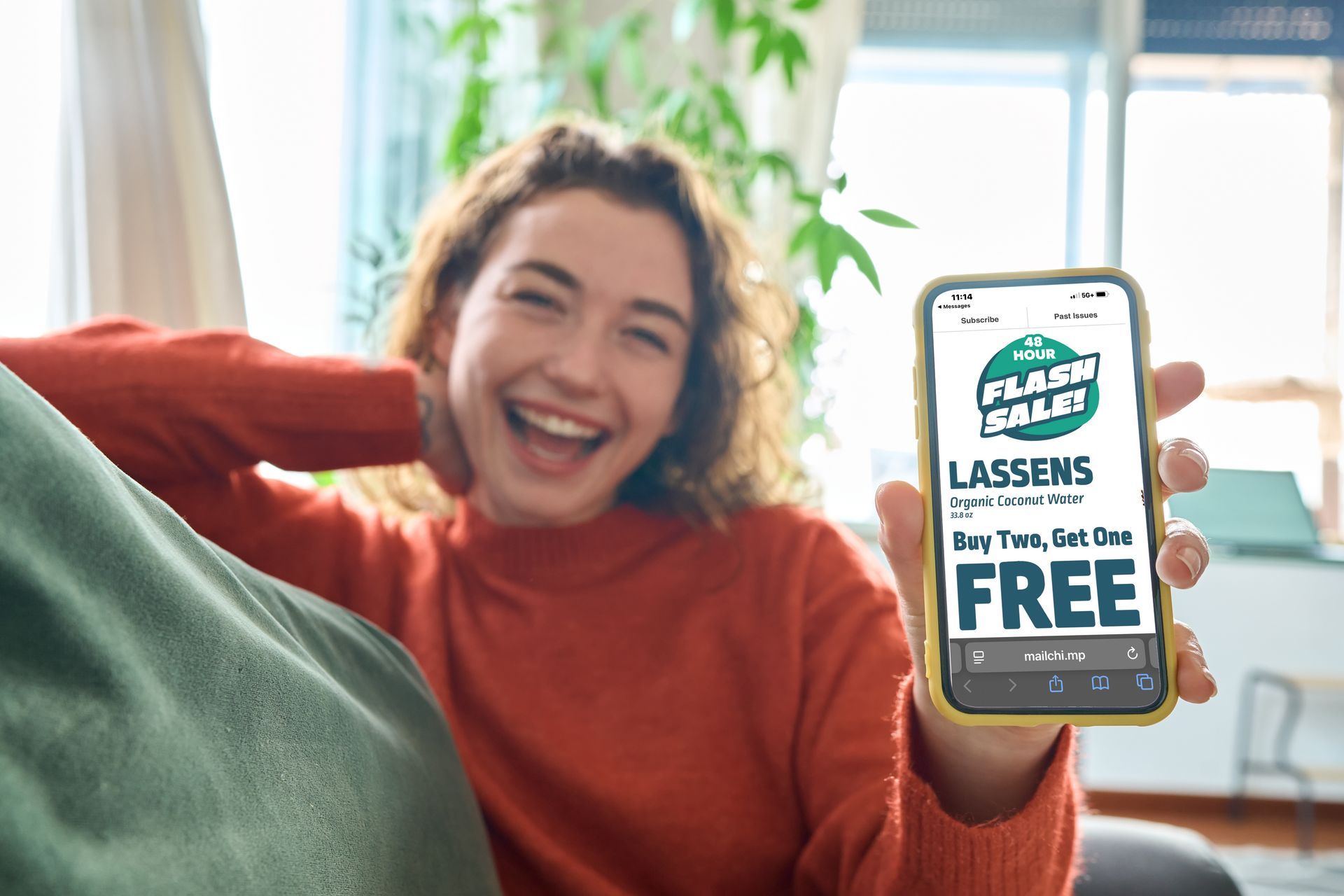 Woman holding phone displaying 