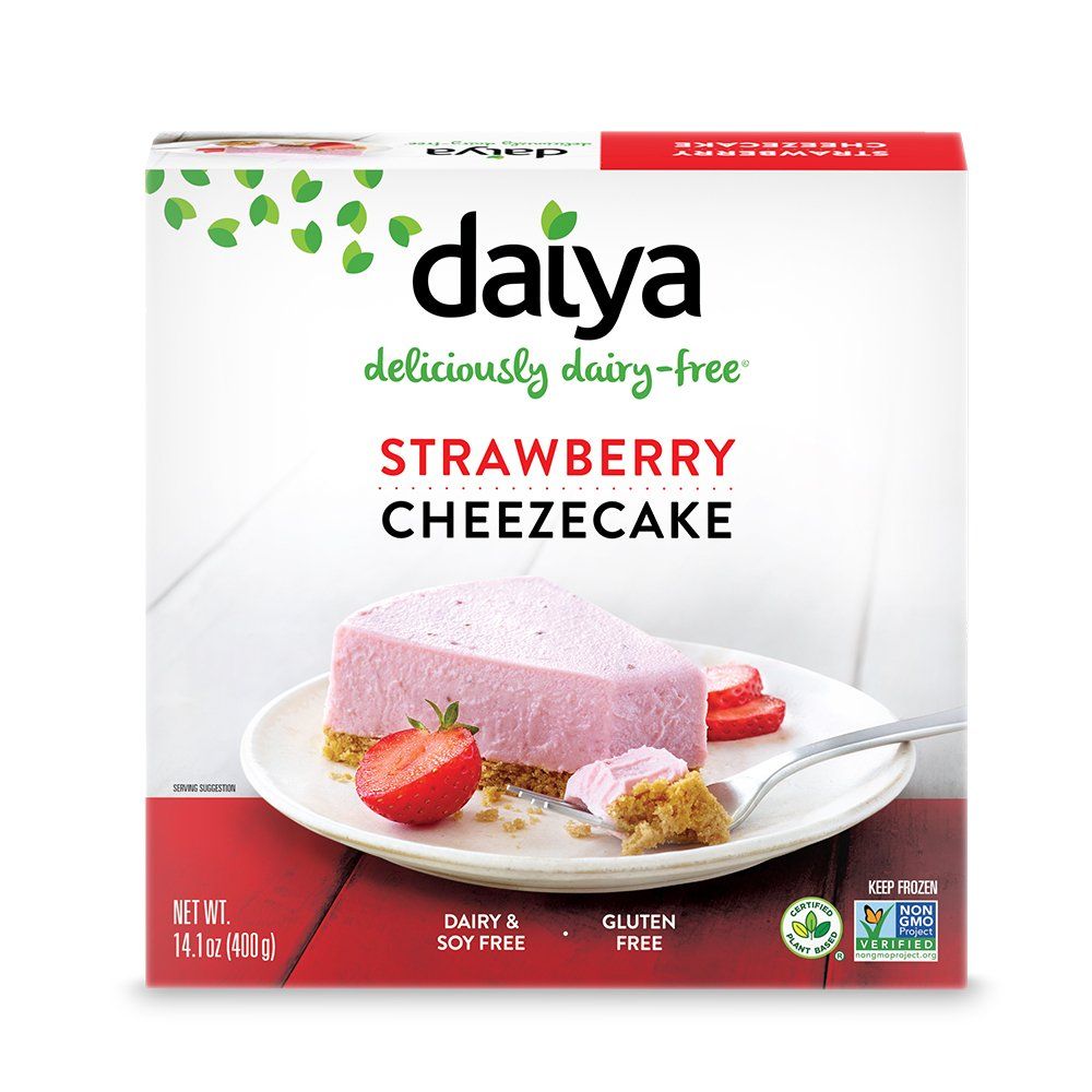 Box of Daiya strawberry cheesecake. The box shows a slice of pink cheesecake on a plate, with a strawberry. Dairy and gluten-free.