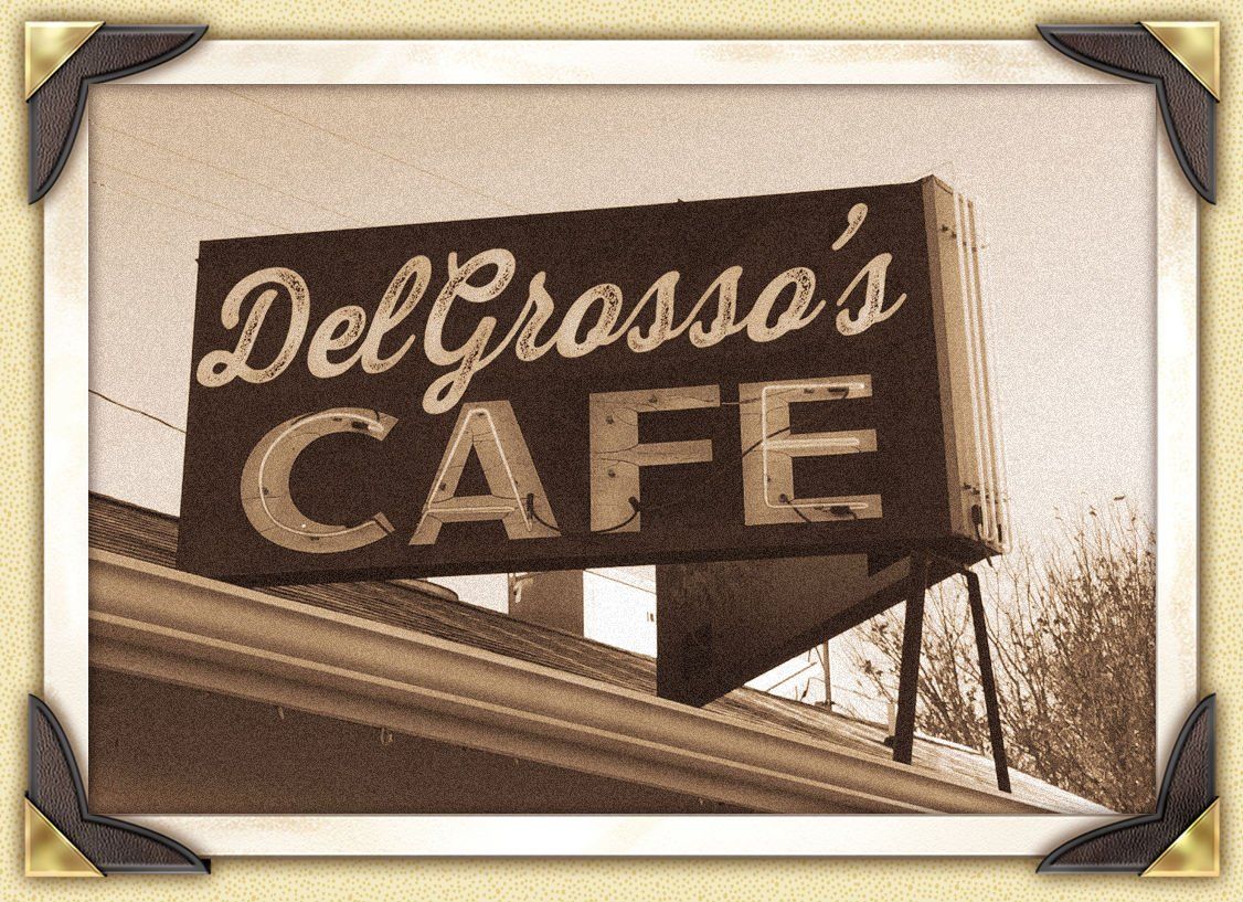 DelGrosso's Cafe sign in sepia tone, mounted on a building roof.