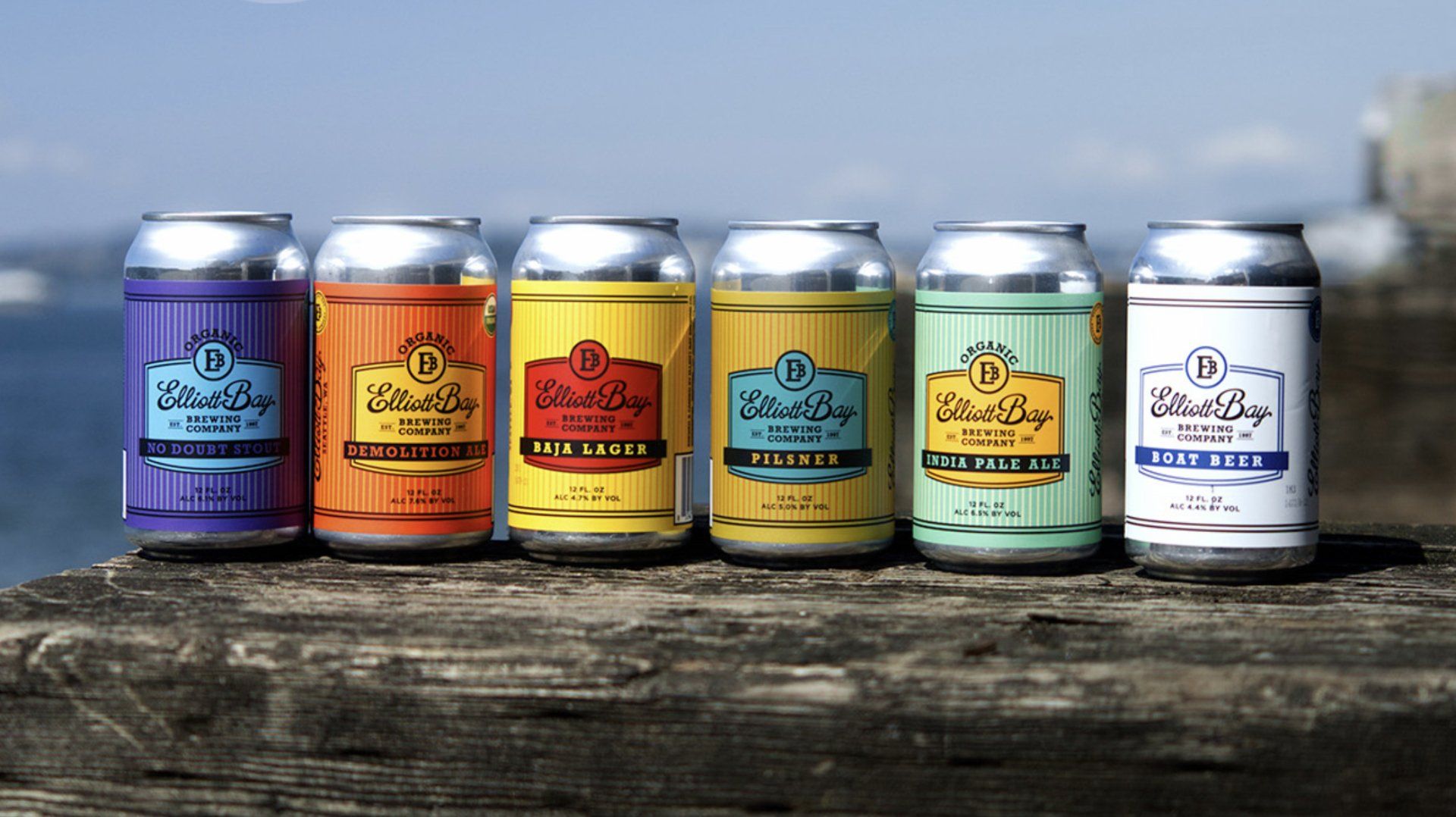 Six colorful cans of 