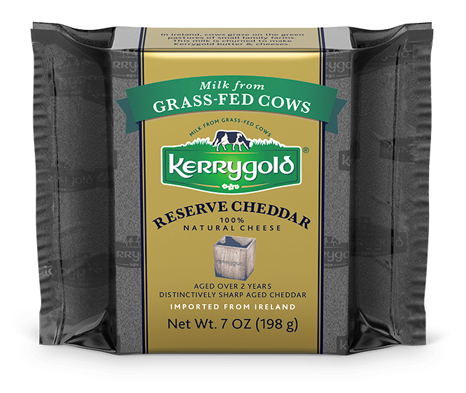 Kerrygold Reserve Cheddar cheese block, packaged in dark grey, with a gold and green label. Milk from grass-fed cows.