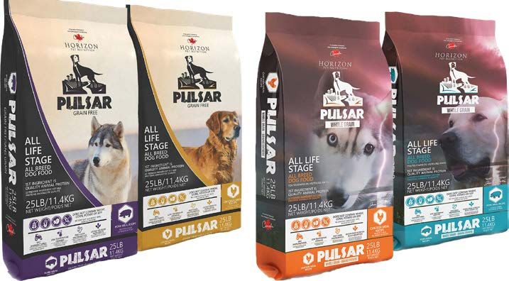 Four bags of Pulsar dog food; two with purple and gold accents, two with orange and teal accents.