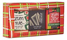 A box set of Zum soap bars in holiday packaging. The soaps are various colors and scents, like spiced almond and peppermint.