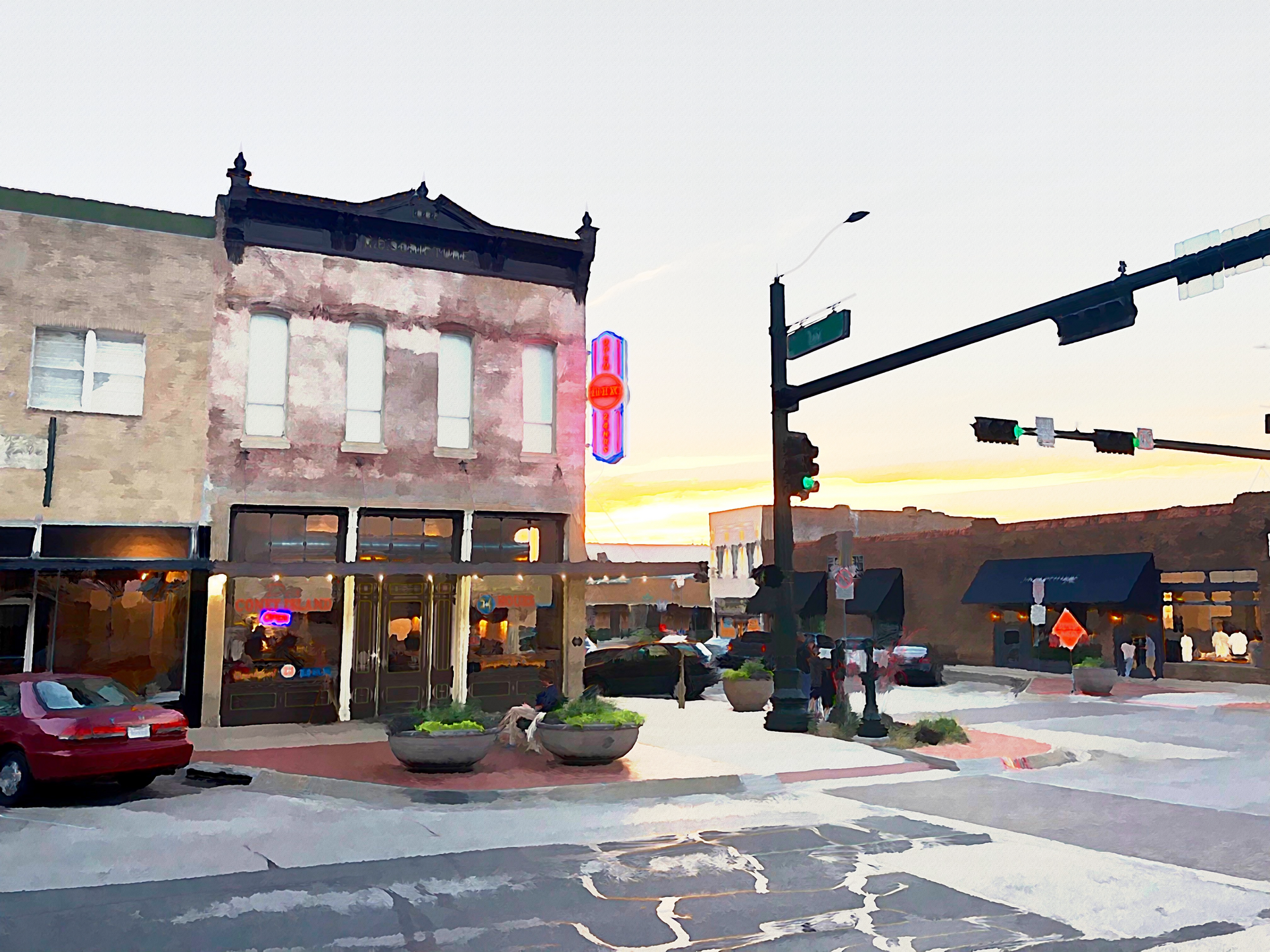 Street corner with brick buildings and a neon sign at dusk.