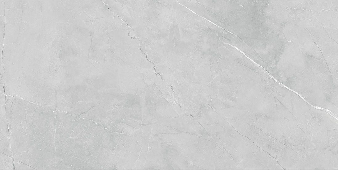 Superficie jaspeada de color gris con vetas y variaciones sutiles.