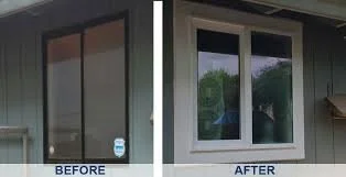 Before and after comparison of windows. Old sliding black windows versus new white double-hung window.
