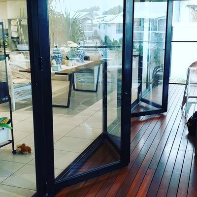 Black-framed Folding Glass Doors — Above and Beyond Locksmiths in Pimpama, QLD