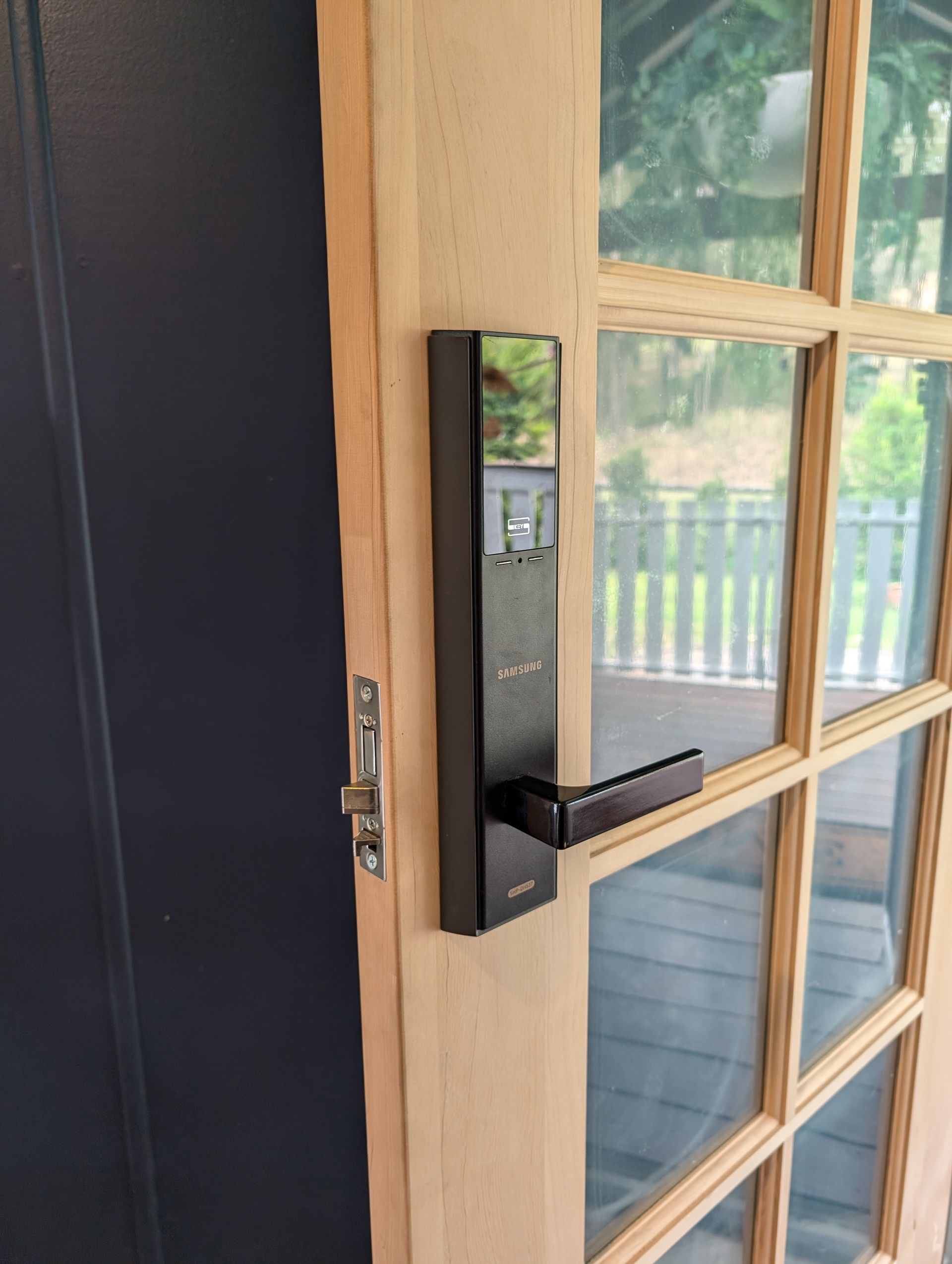 A Sleek, Black Electronic Smart Lock Installed — Above and Beyond Locksmiths in Pimpama, QLD