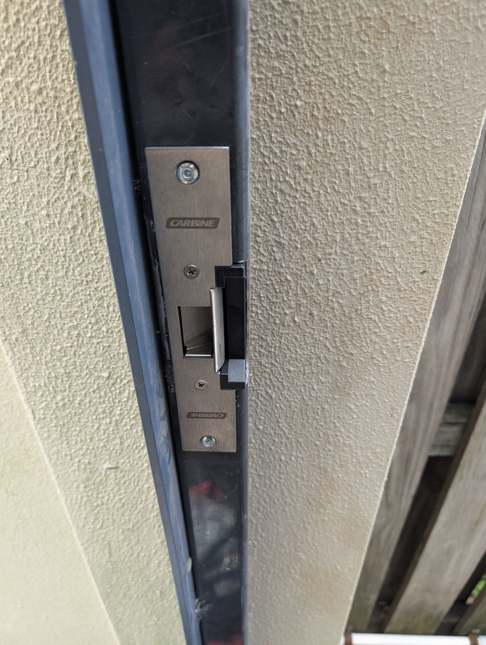An Electric Strike Plate Mounted on a Door Frame — Above and Beyond Locksmiths in Pimpama, QLD