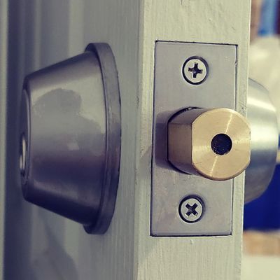 A Close-up of a Silver Deadbolt Lock — Above and Beyond Locksmiths in Coomera, QLD