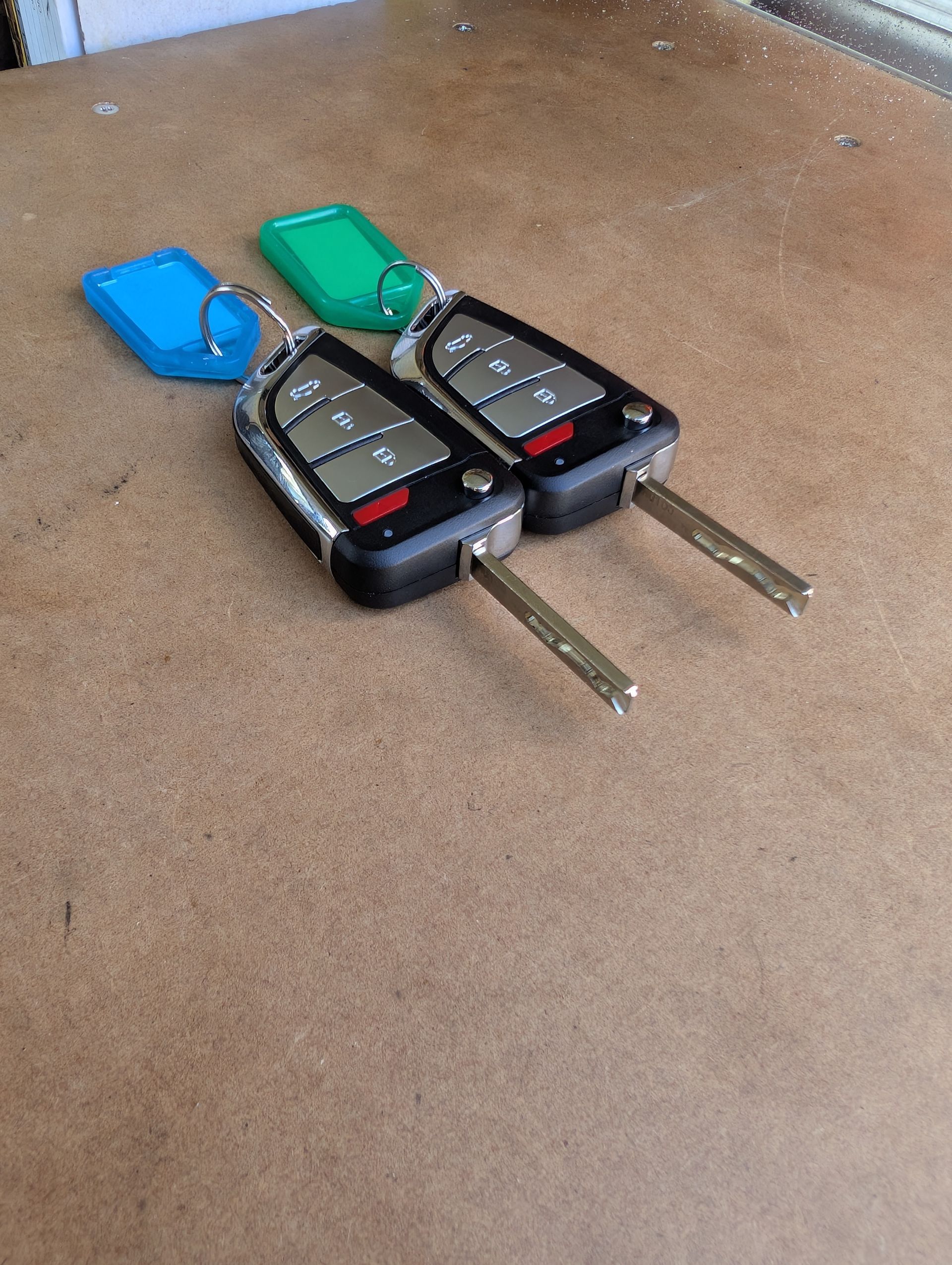 Two Flip-style Car Key Fobs — Above and Beyond Locksmiths in Hope Island, QLD