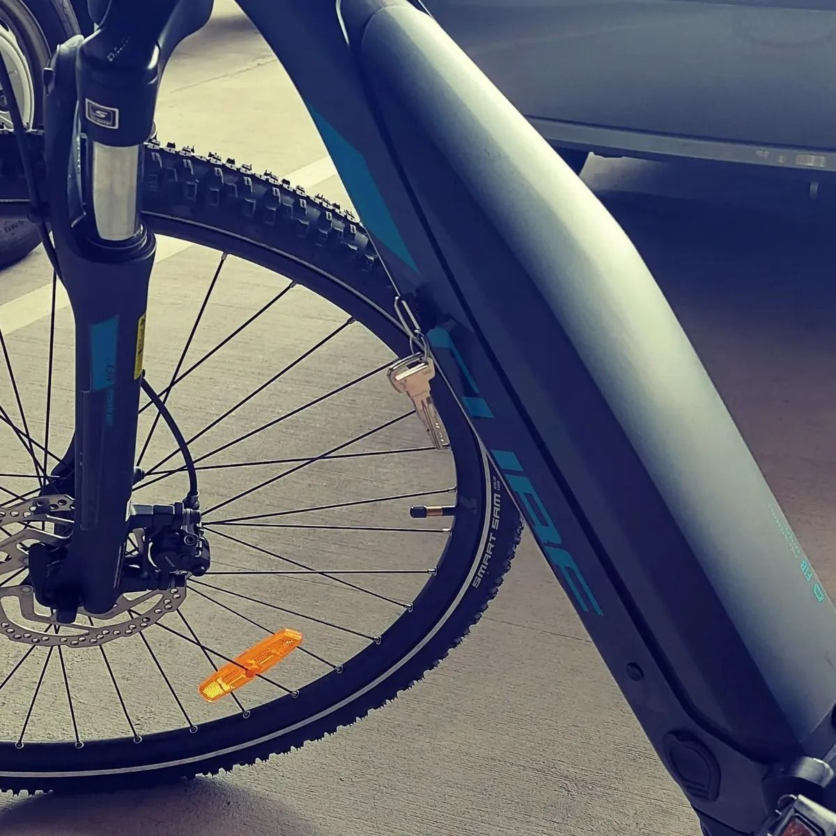 A Close-up View of an E-bike Frame With a Key Left — Above and Beyond Locksmiths in Pimpama, QLD