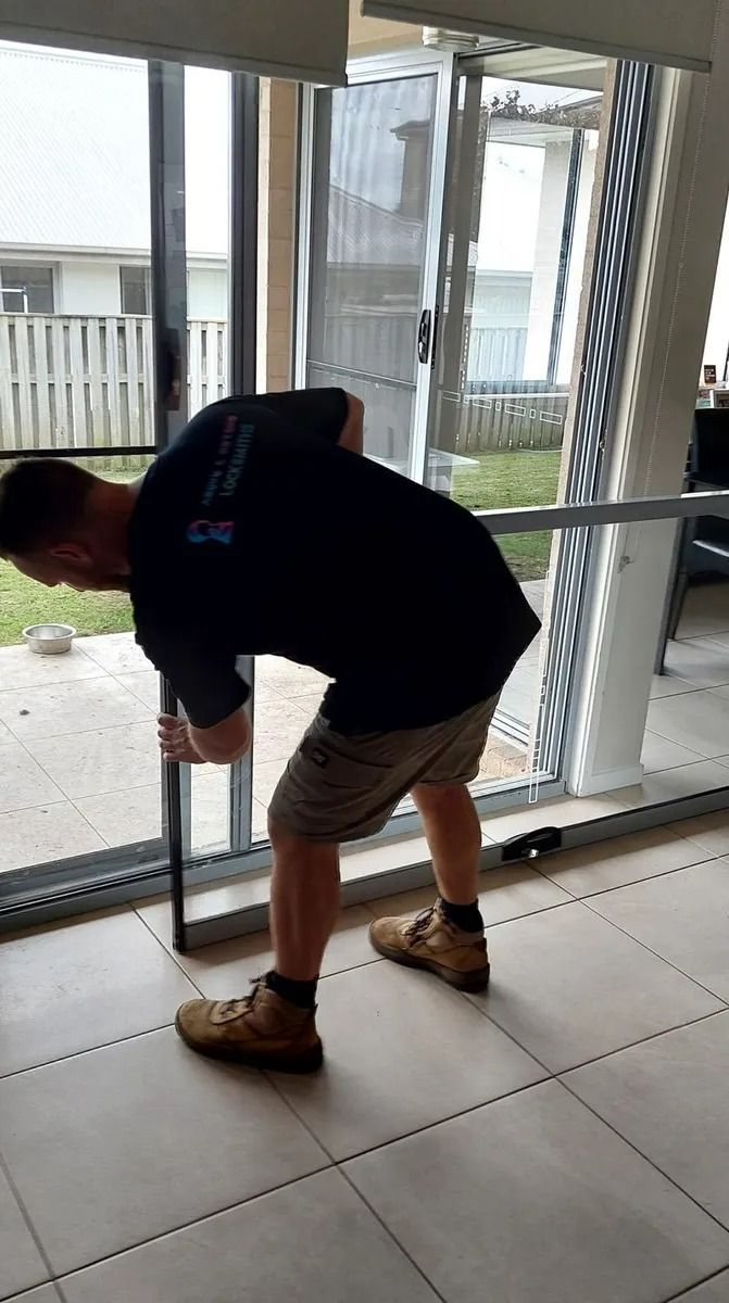 A Person in a Black Shirt and Tan Shorts — Above and Beyond Locksmiths in Pimpama, QLD