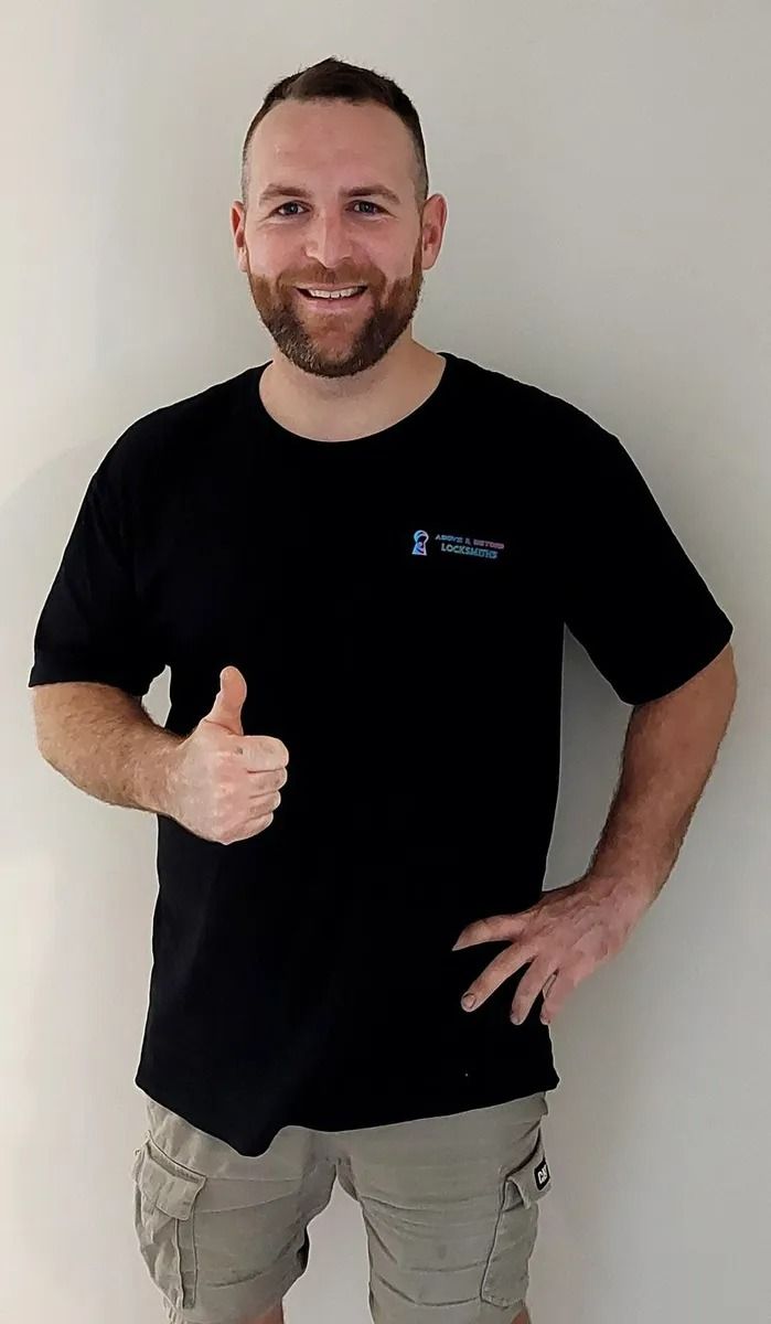 A Smiling Person With a Beard — Above and Beyond Locksmiths in Pimpama, QLD