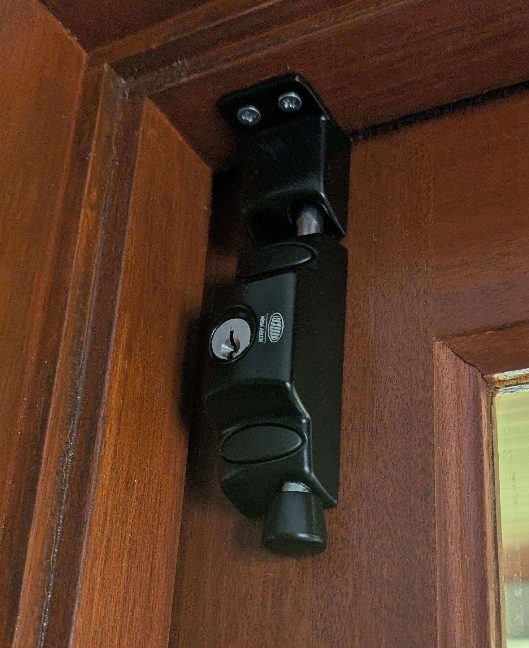 A Black, Vertical Key-operated Door Security Lock — Above and Beyond Locksmiths in Helensvale, QLD