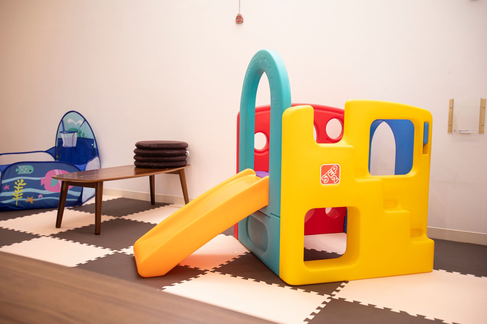 There is a slide in the middle of the room.