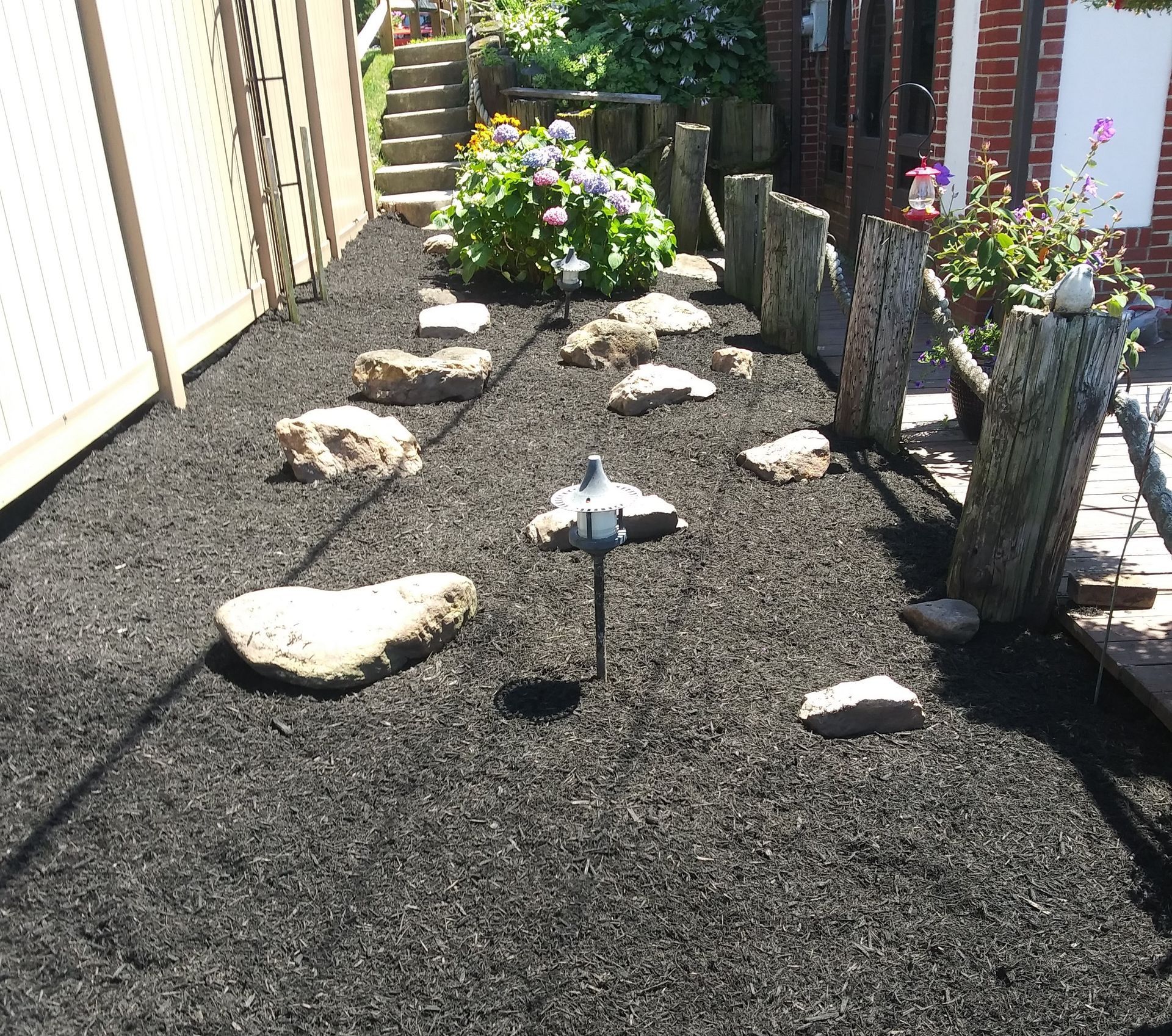 A garden with a lot of rocks and flowers