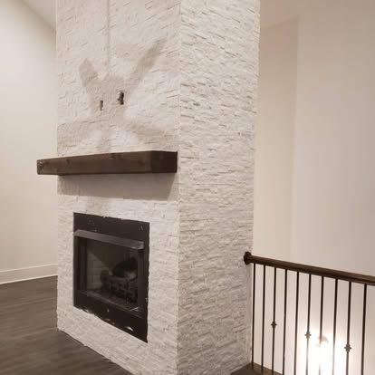 There is a fireplace in the middle of the room.